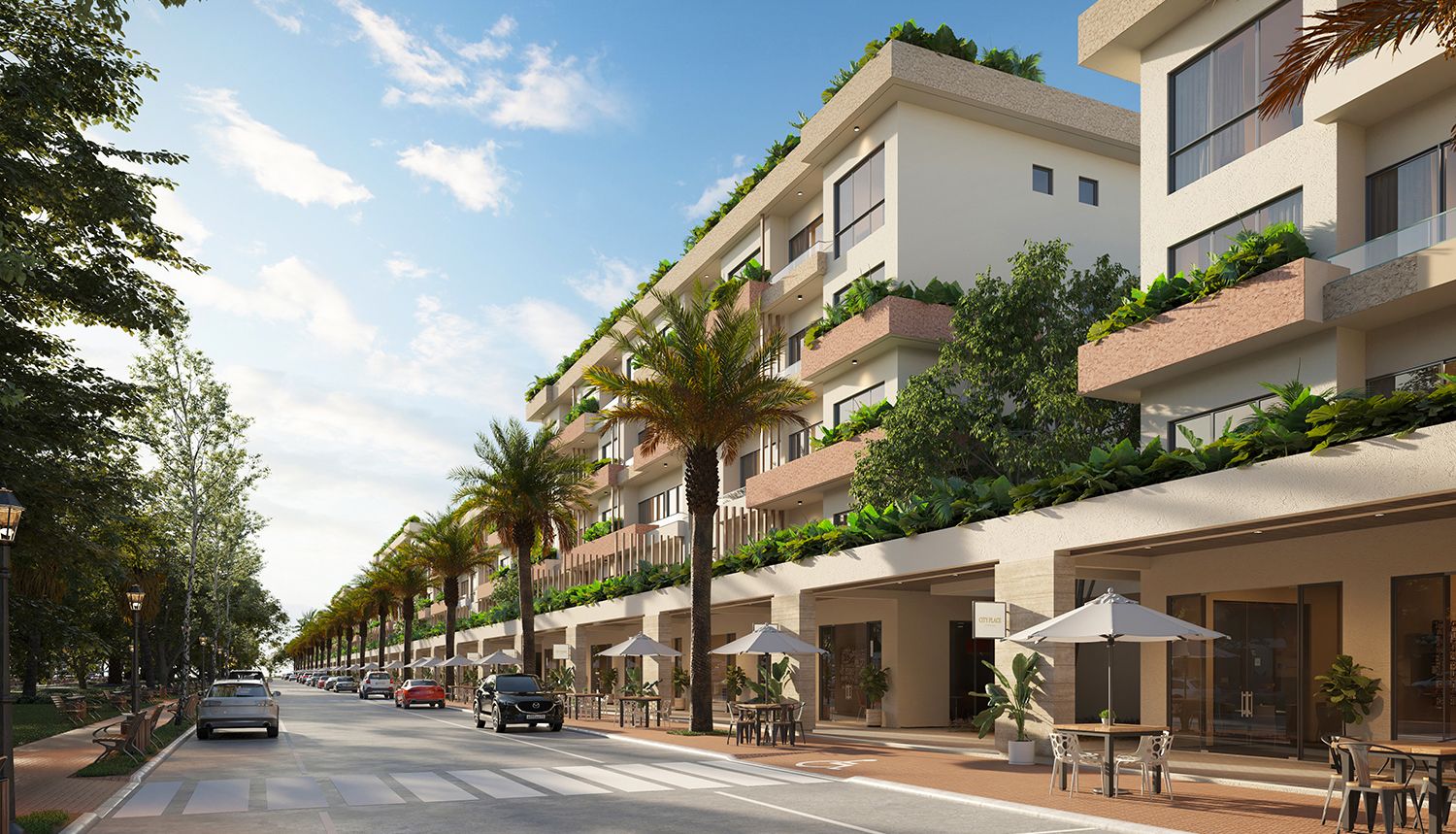 Apartment buildings and a tree-lined shopping boulevard at City Place Punta Cana